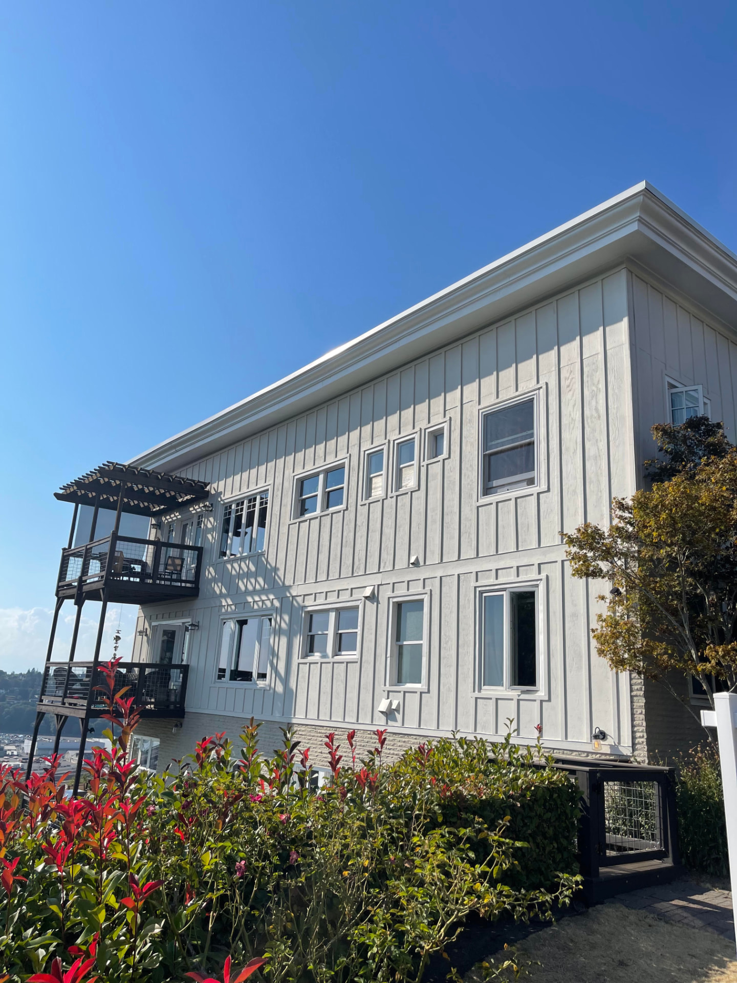 Freshly painted white board-and-batten home exterior